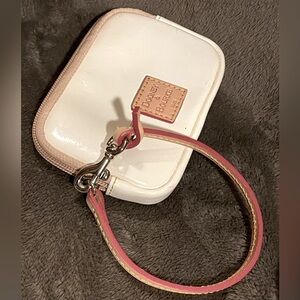 Dooney & Bourke cream patent‎ leather wristlet with an ID pocket on back